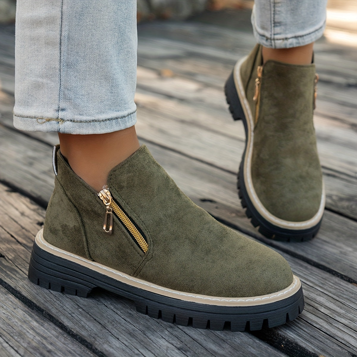 Green ELARA ankle boots worn with jeans