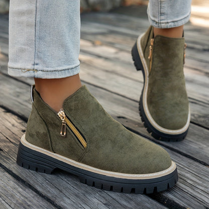 Green ELARA ankle boots worn with jeans