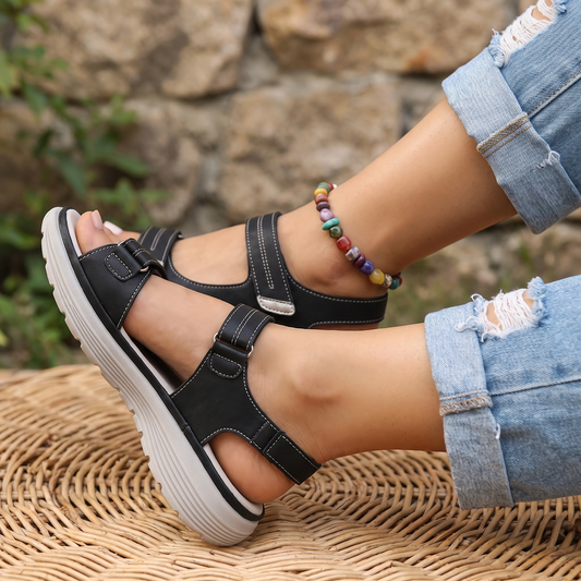 Seabreeze black crossed feet on stone and wicker